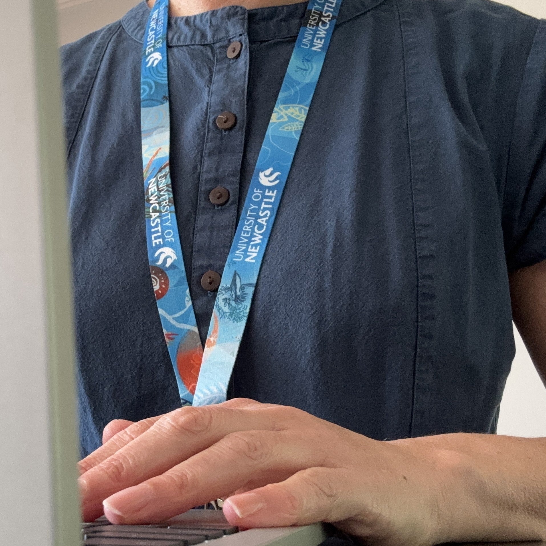 MANY VOICES, ONE COMMUNITY LANYARD
